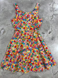 Yellow candy print a-line skater dress with pockets featuring a vibrant sleeveless design and colorful candy pattern