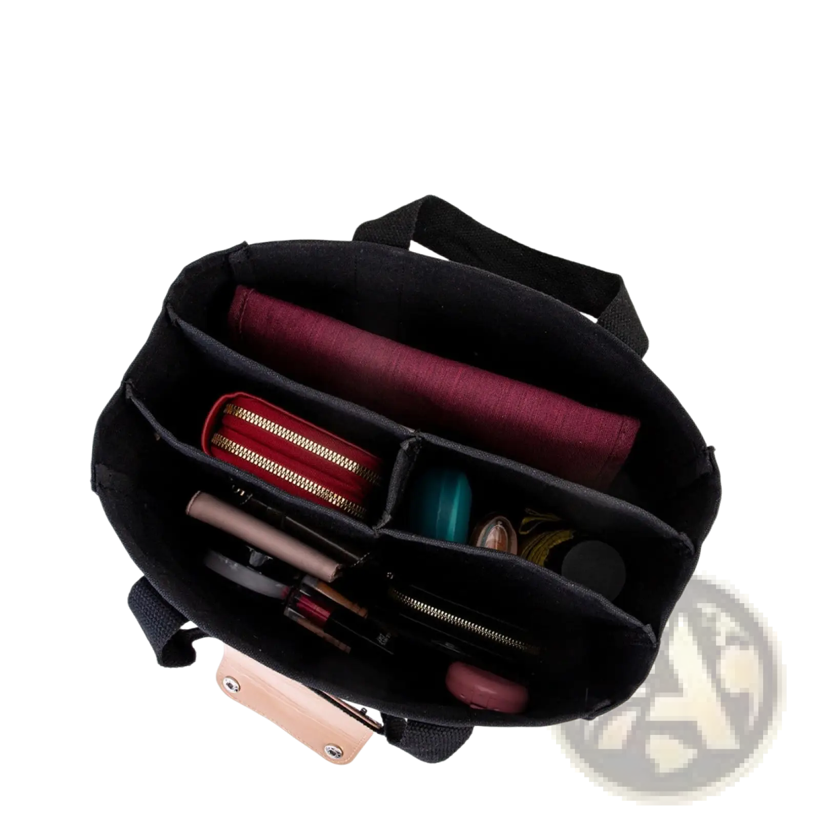 Black fabric organizer with compartments holding makeup and red pouch inside canvas messenger bag mother and baby tote
