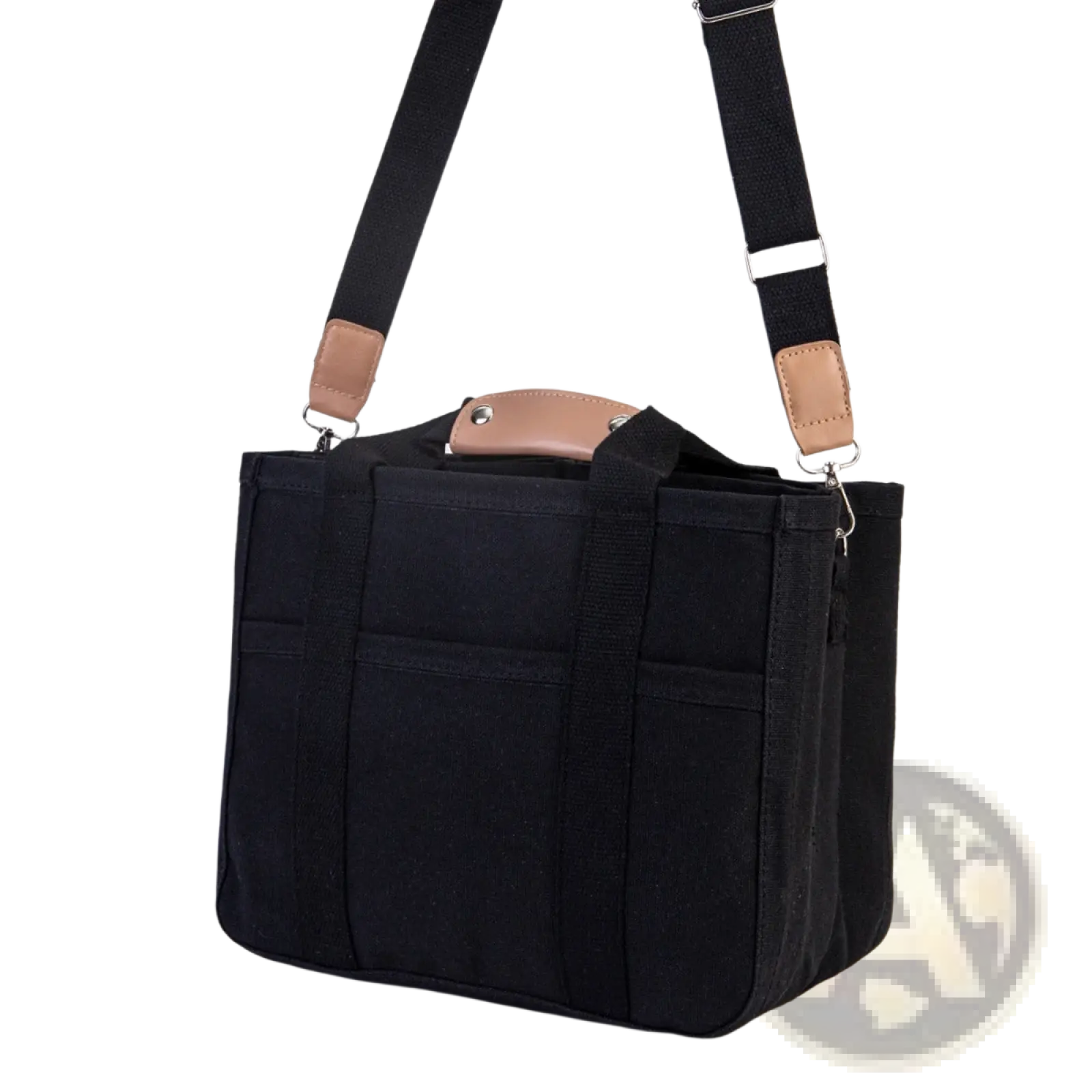 Black canvas messenger bag with tan leather accents and adjustable shoulder strap for mother and baby travel tote