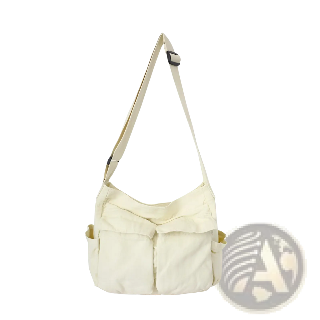 Cream-colored canvas shoulder bag with single adjustable strap and front pockets large multi pocket retro tote