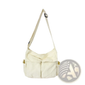 Cream-colored canvas shoulder bag with single adjustable strap and front pockets large multi pocket retro tote