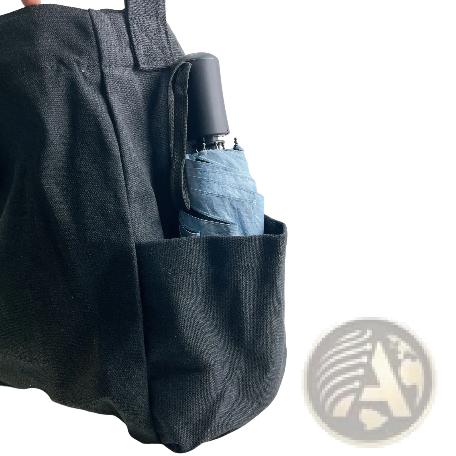 Black canvas large multi pocket retro tote shoulder bag with folded light blue umbrella in side pocket