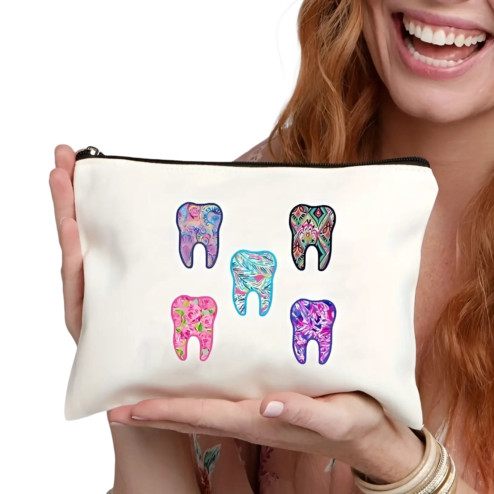 White canvas makeup pouch featuring five colorful patterned tooth designs in pink blue purple and teal
