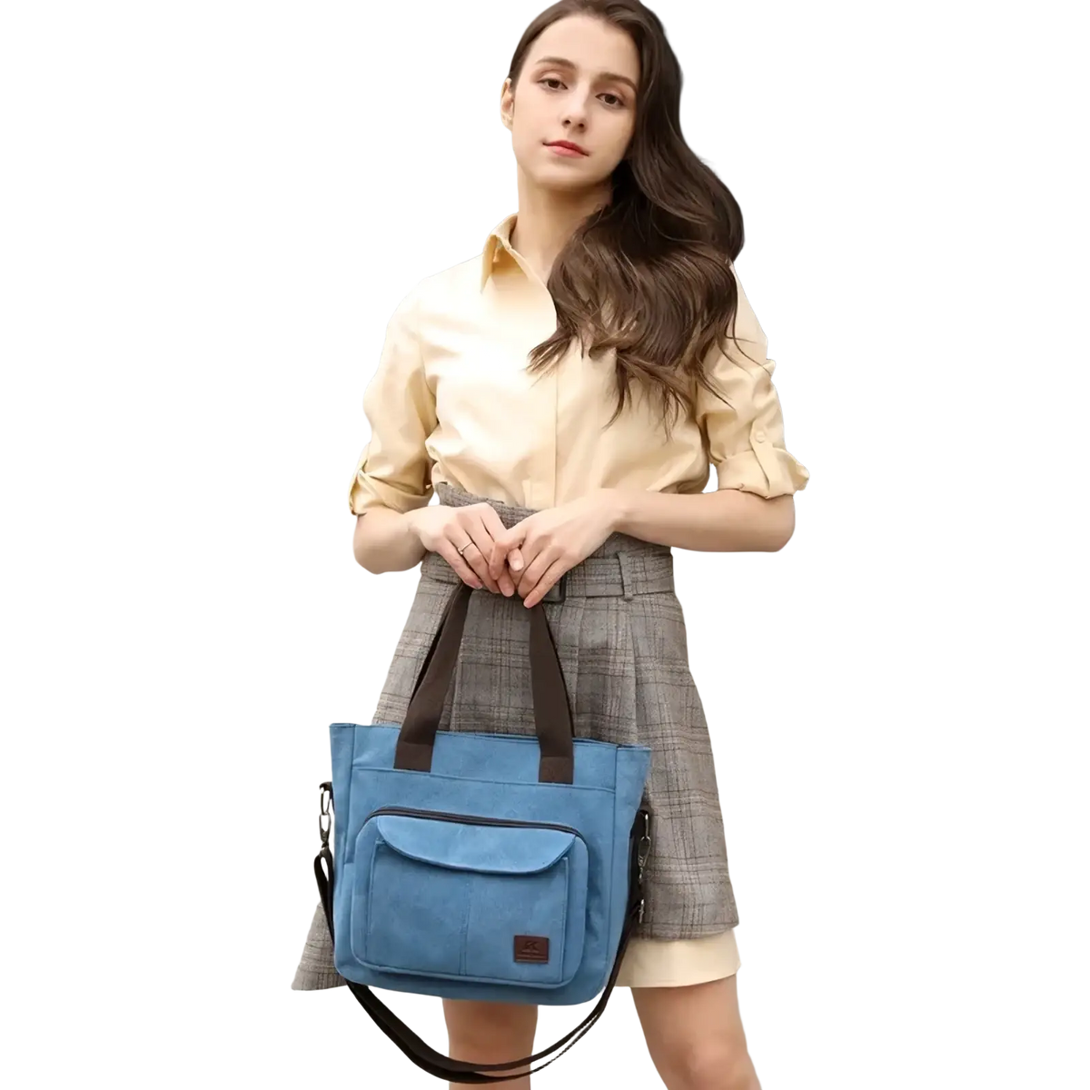 Blue canvas tote bag with brown handles and detachable black shoulder strap designed for work and everyday use