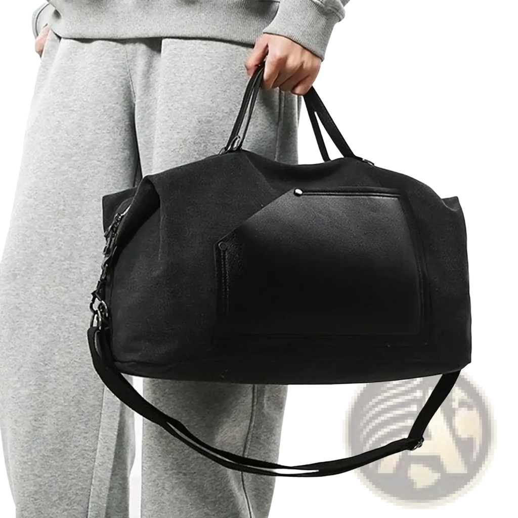 Black canvas travel duffel bag with large capacity waterproof design and textured front panel with adjustable strap