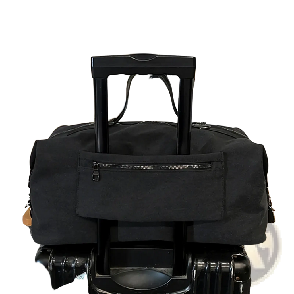 Black canvas travel duffel bag with large capacity waterproof material, front zippered pocket, and retractable handle