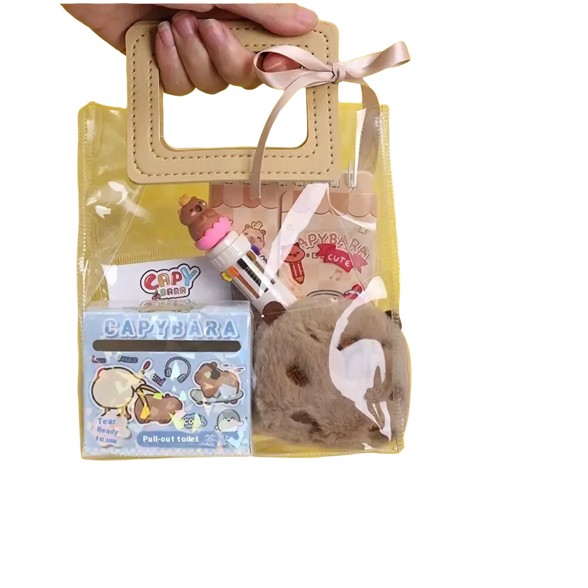 Clear plastic gift bag with beige leather-like handle and ribbon containing kawaii capybara stationery set for students
