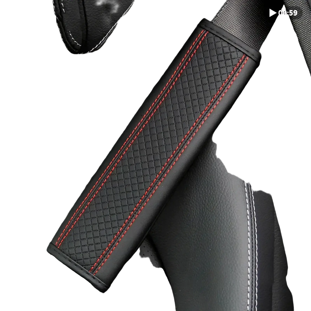 Black leather seat belt cover with red stitching along the edges for added comfort and style in vehicles