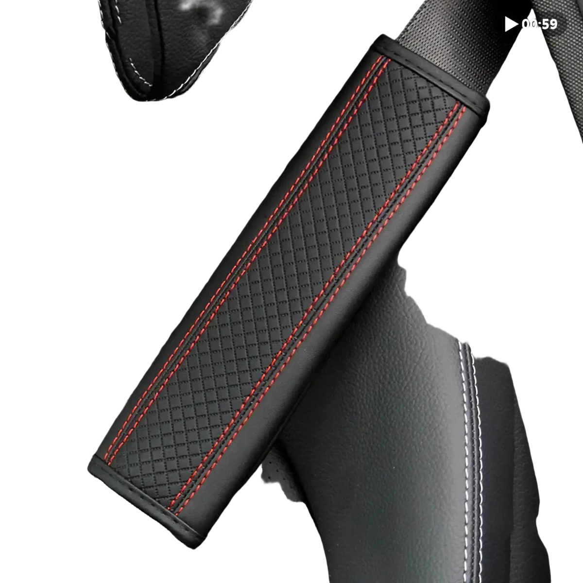 Black leather seat belt cover with red stitching along the edges for added comfort and style in vehicles