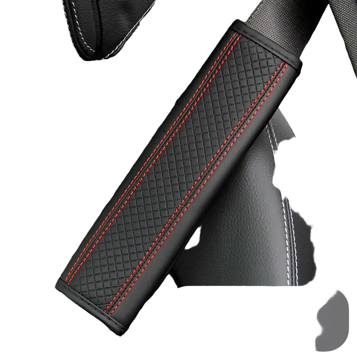 Leather seat belt cover in black textured leather with red stitching and white piping along the edges