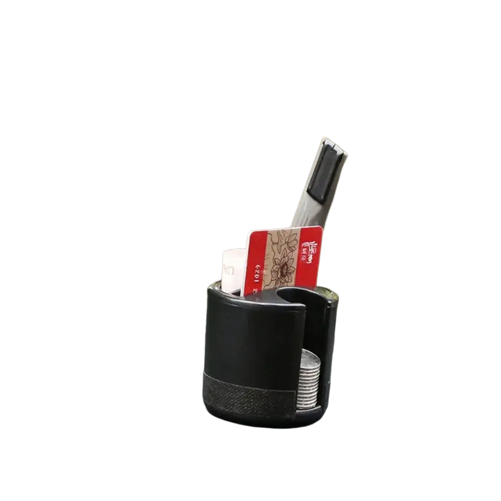 Black cylindrical car coin card organizer holder with textured grip and open top holding cards coins and a pen
