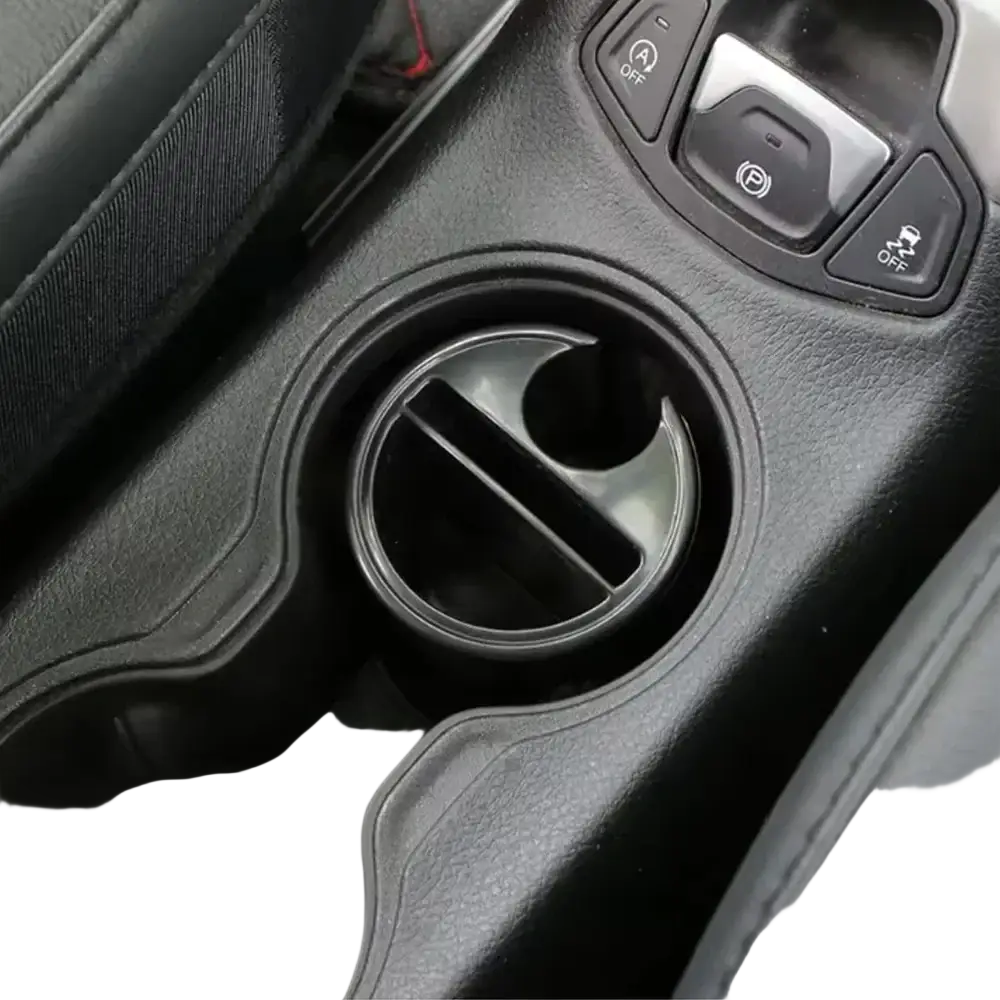 Black plastic car coin card organizer holder with sleek curved design and integrated divider for cup holder storage