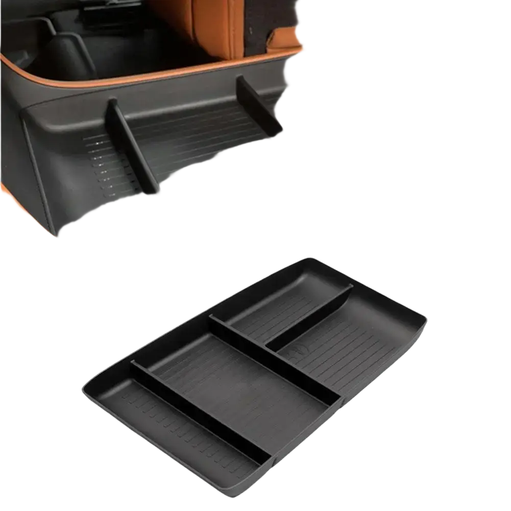 Black plastic car console organizer tray with multiple compartments and textured ABS storage box surfaces