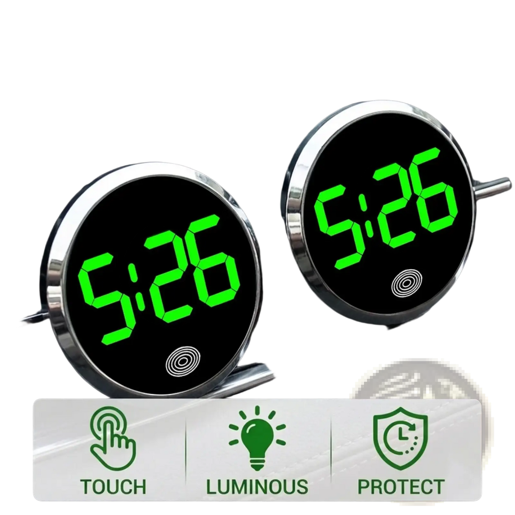 Two circular car dashboard digital clocks with bright green led touch displays and silver metallic frames mounted in air vents