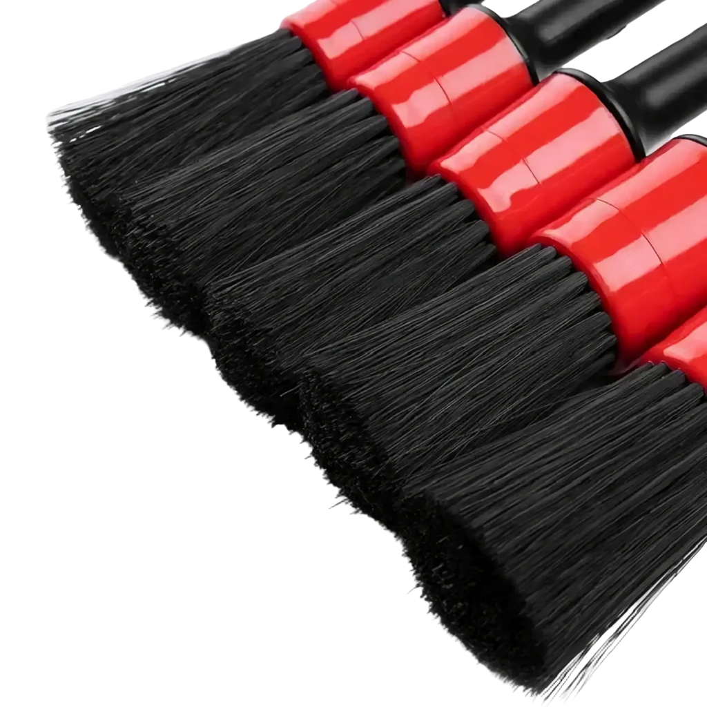 Set of four red and black nylon car detailing brushes with dense soft bristles for effective cleaning