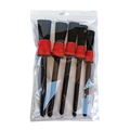 Set of five black-bristled car detailing brushes with red plastic handles in clear plastic packaging