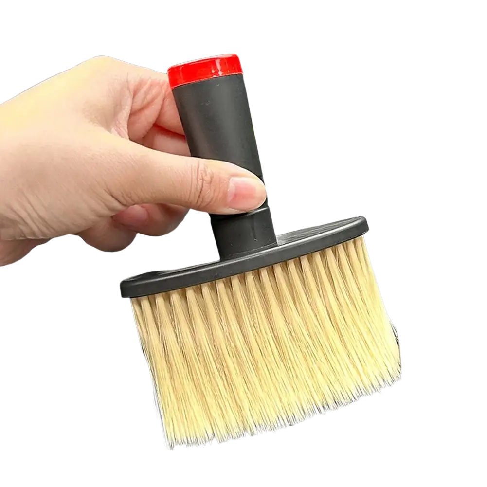 A compact car detailing brush with a black handle red cap and soft light bristles for interior cleaning