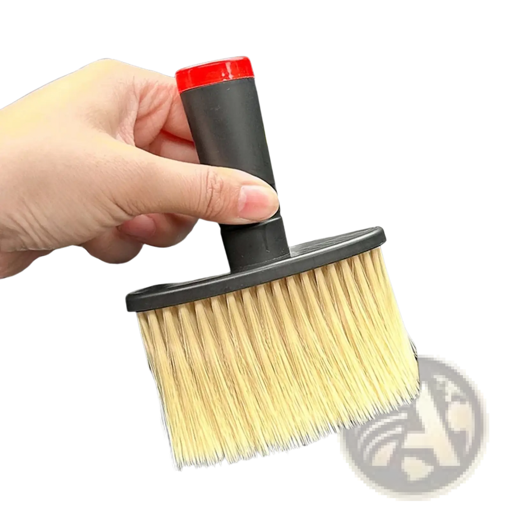 A compact car detailing brush with a black handle red cap and soft light bristles for interior cleaning