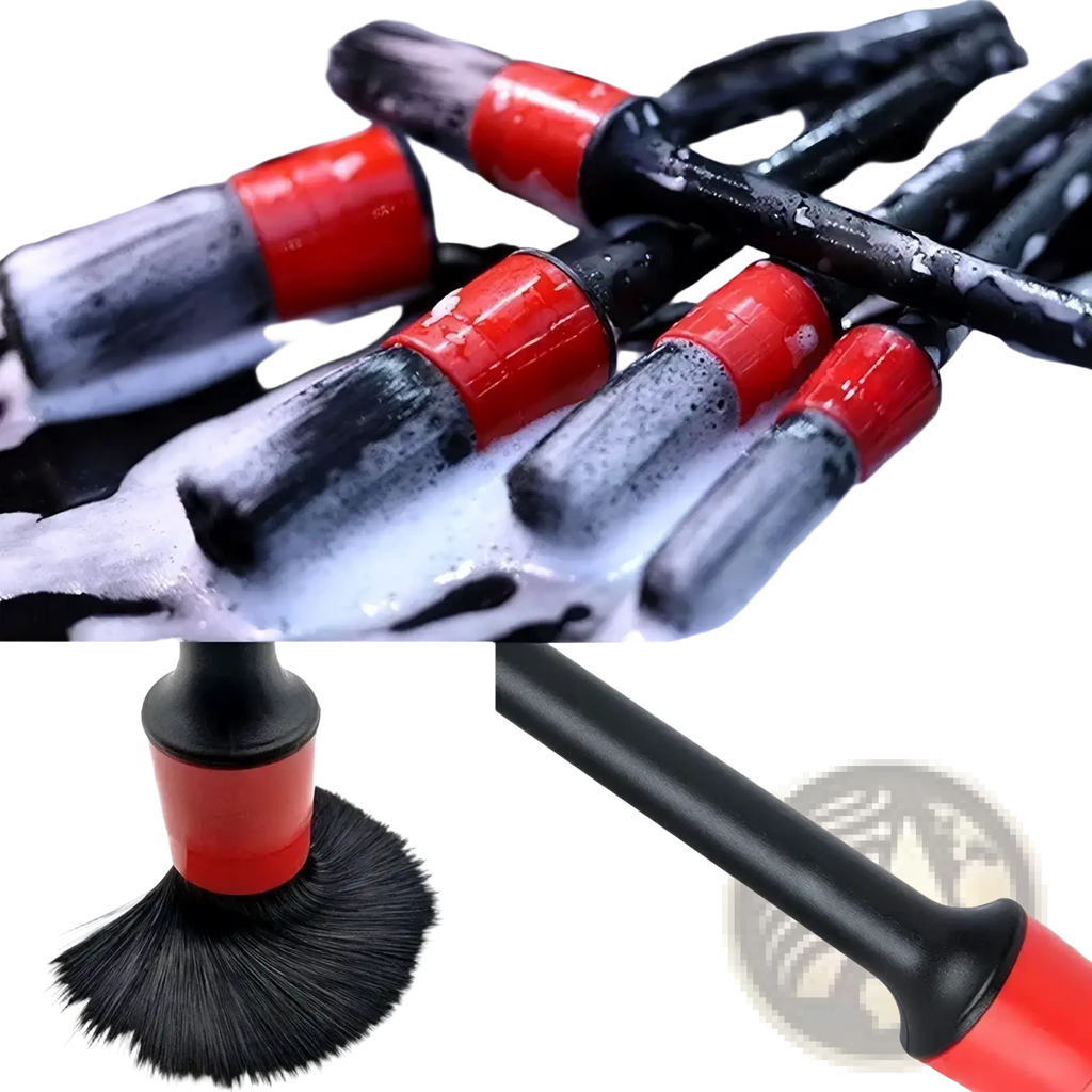 Red and black car detailing brush with sturdy plastic handle from car detailing kit and cleaning brush set