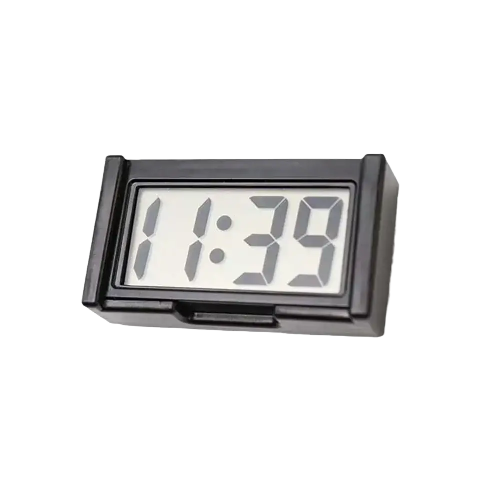 Black rectangular car digital clock dashboard time display with white segmented digital numbers showing 1:39