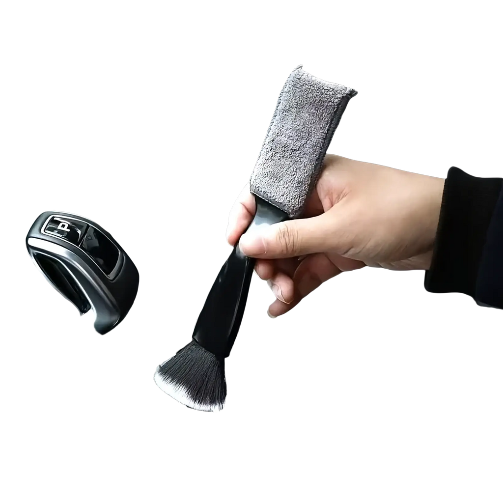 Car interior detailing brush with black handle soft bristles and gray microfiber cloth sleeve for cleaning