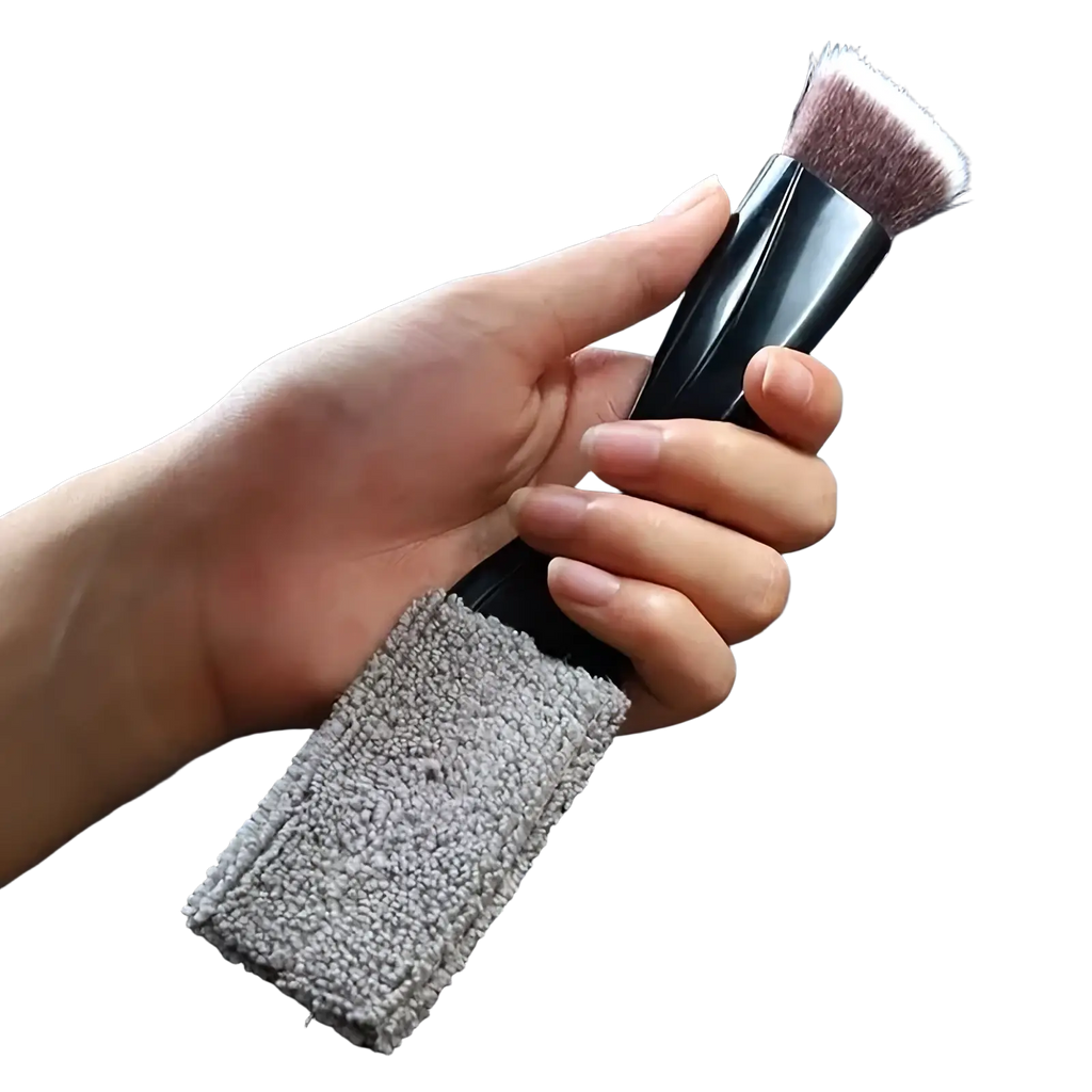 Black car interior detailing brush with gray microfiber cleaning strap attached to handle for precise cleaning