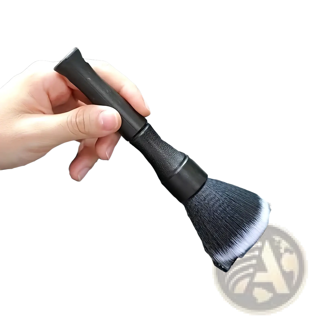 Black car interior soft bristle detailing brush with dense soft bristles and textured grip handle shown from the back side