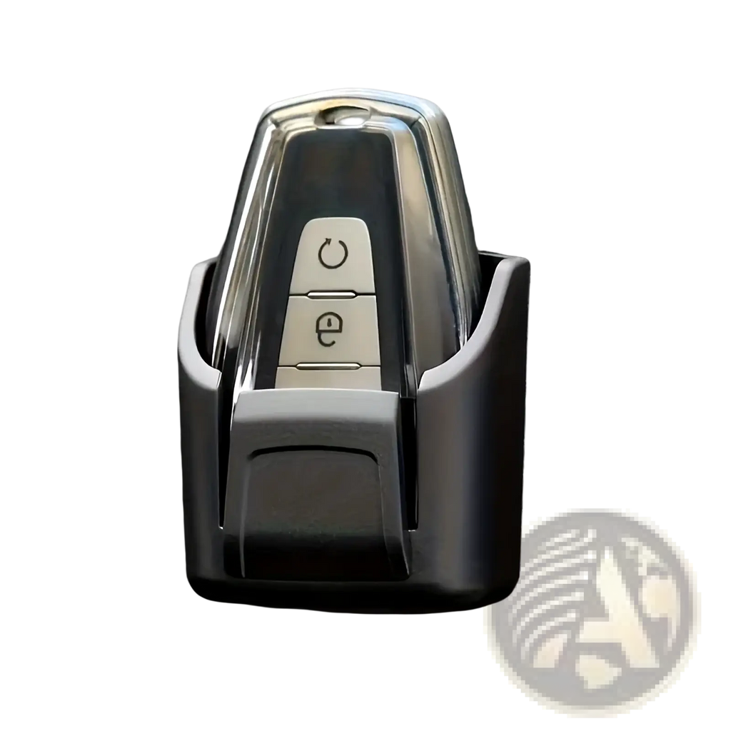 Chrome-finished car key fob with two buttons housed in sleek black plastic car key organizer dashboard storage box