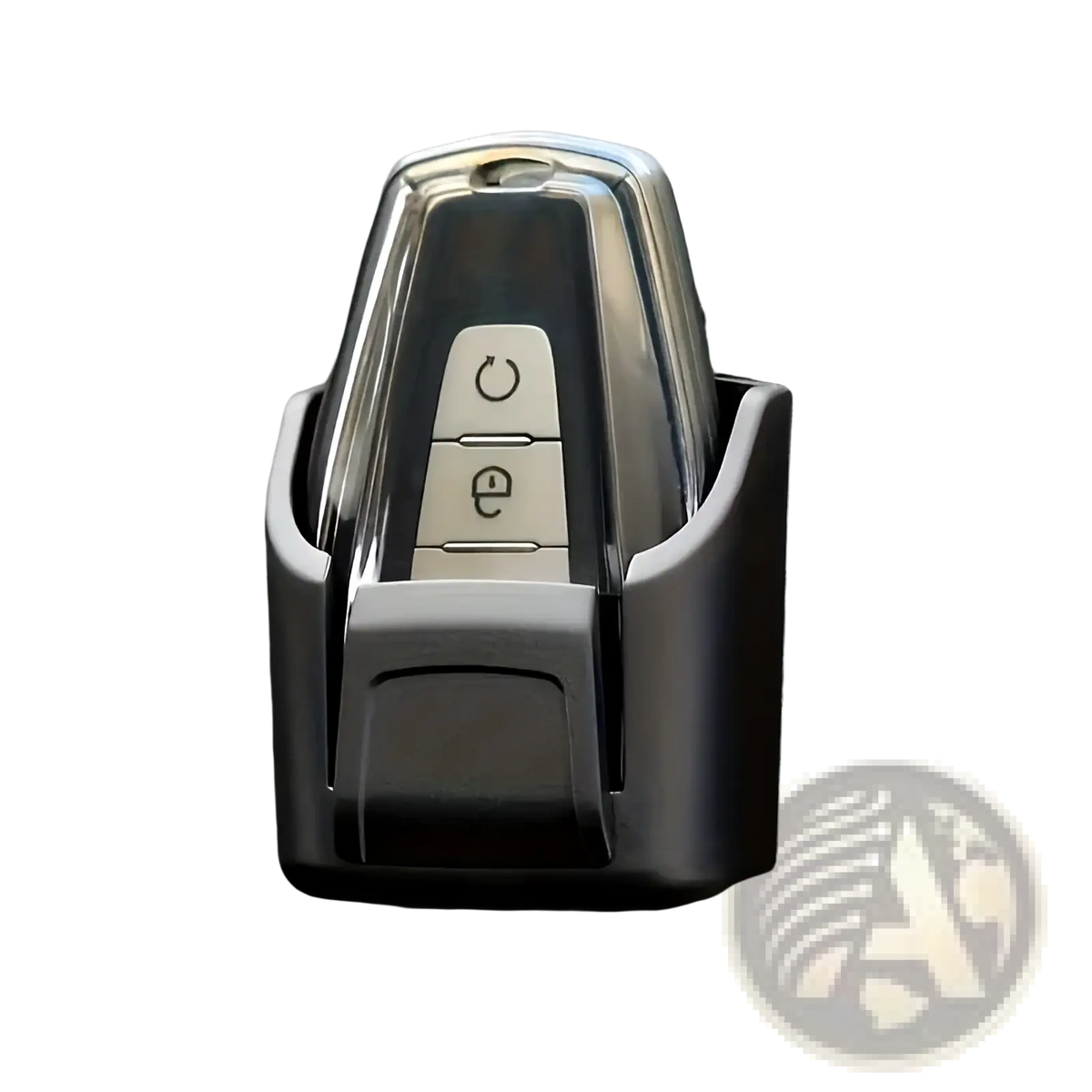 A sleek chrome car key fob with two buttons secure in a black plastic car key organizer dashboard storage box