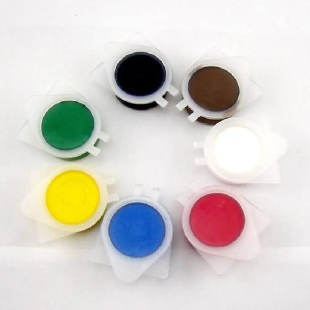Set of seven colorful round plastic-capped paint pots arranged in a circle for professional car leather and interior repair kit