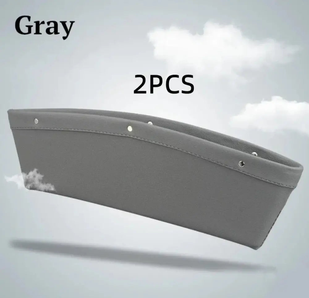 Gray premium pu leather car seat gap organizer with sleek curved design, reinforced stitching, and metallic rivets for secure attachment