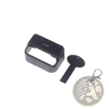 Black plastic car seat belt buckle cover child safety protector with matching key-shaped tool and silver metal clasp