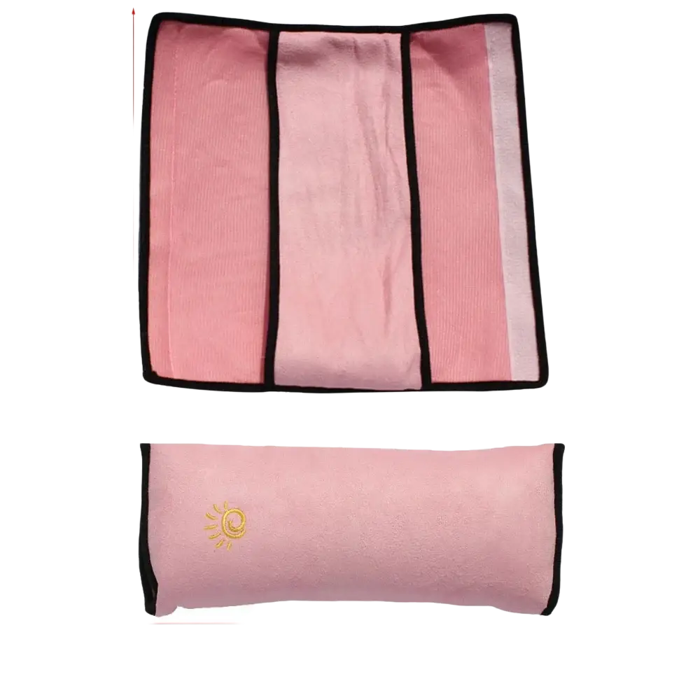 Pink microfiber car seat belt pillow with black trim and gold sun emblem for kids head and neck support