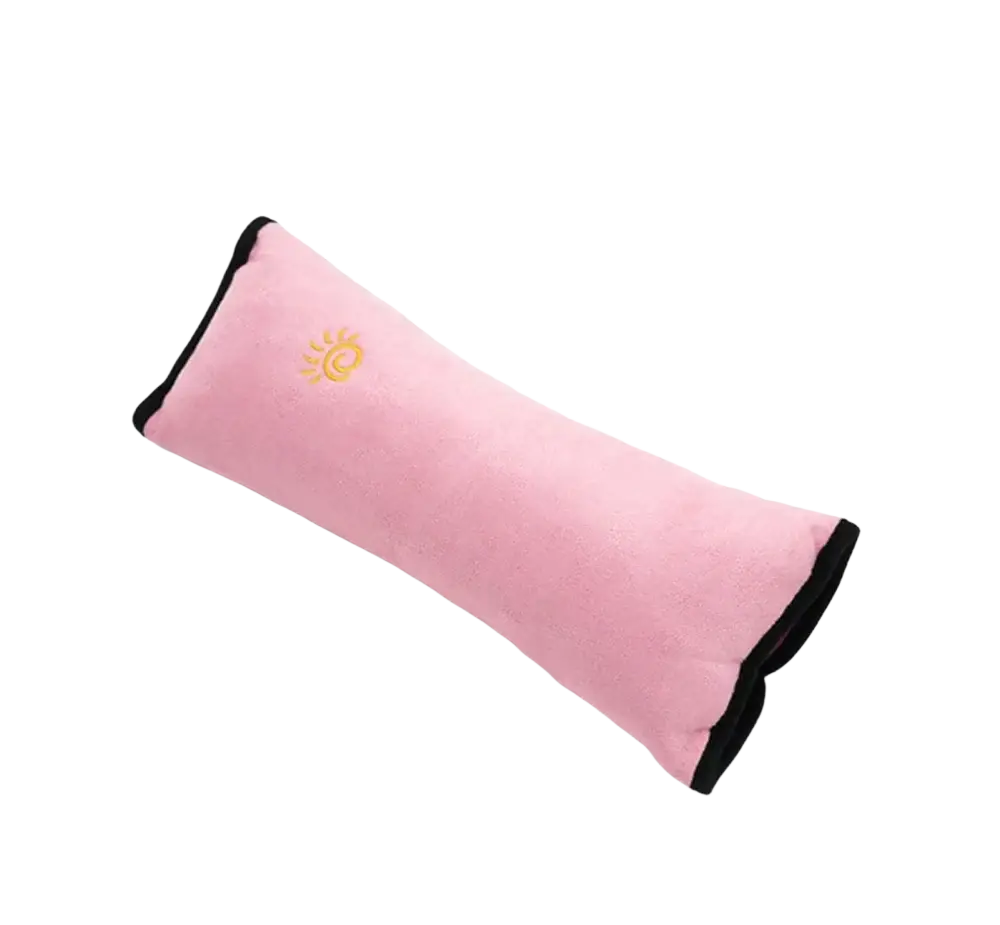 Pink plush car seat belt pillow with black trim and golden sun emblem for kids head and neck support