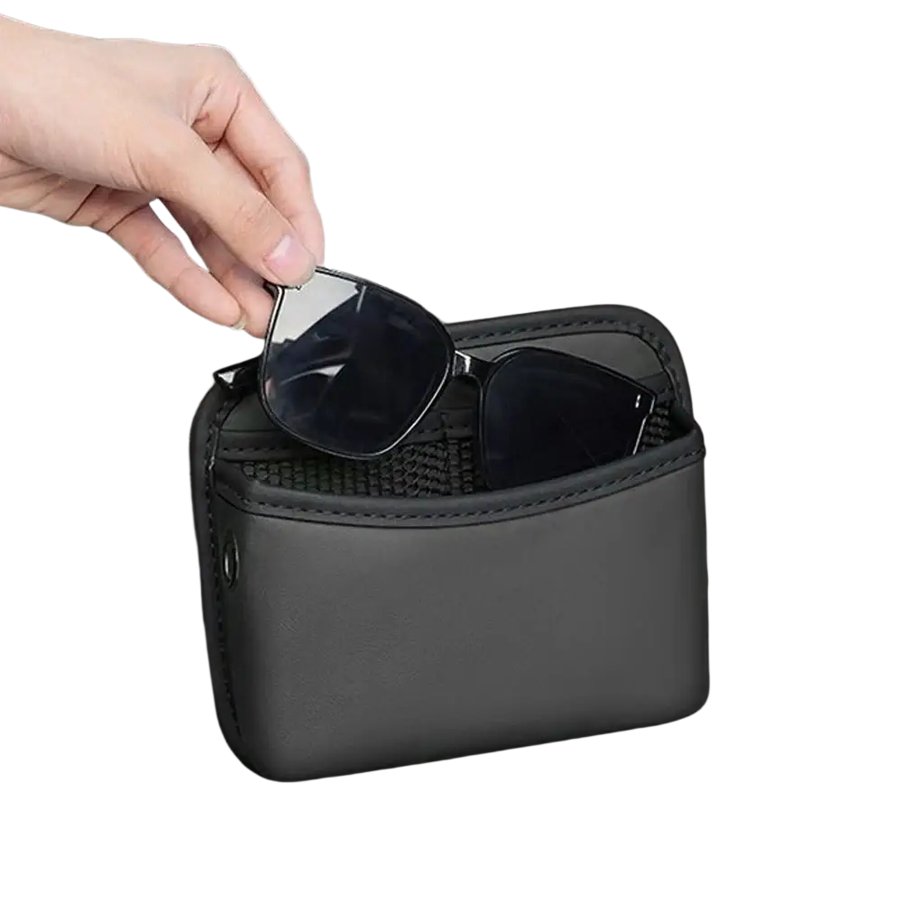 Black faux leather car storage pocket organizer with mesh interior holding sunglasses for center console use