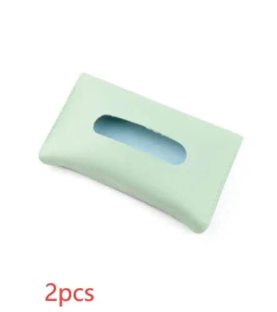 Premium leather car sun visor tissue box holder in light green silicone with a smooth matte finish and elongated oval opening