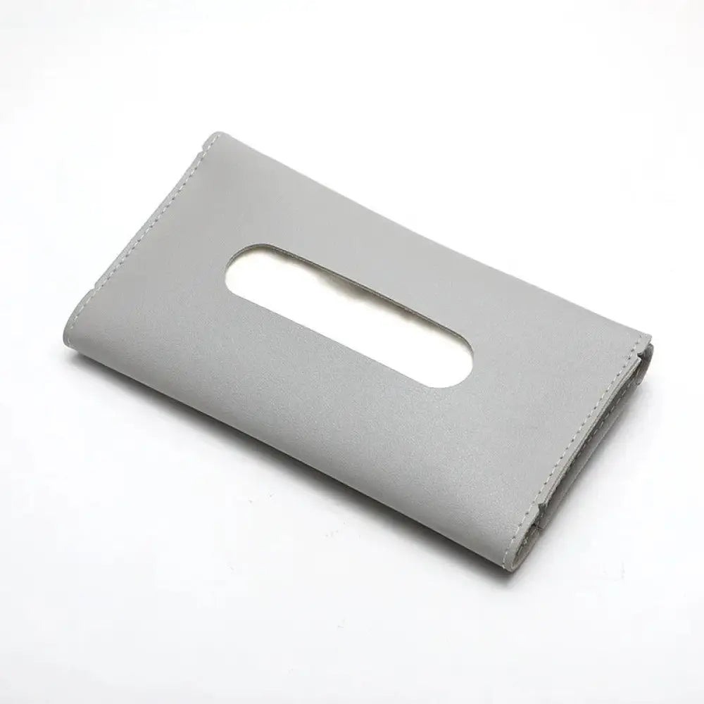 Premium leather car sun visor tissue box holder in gray leather with smooth minimalist design and central oval cutout