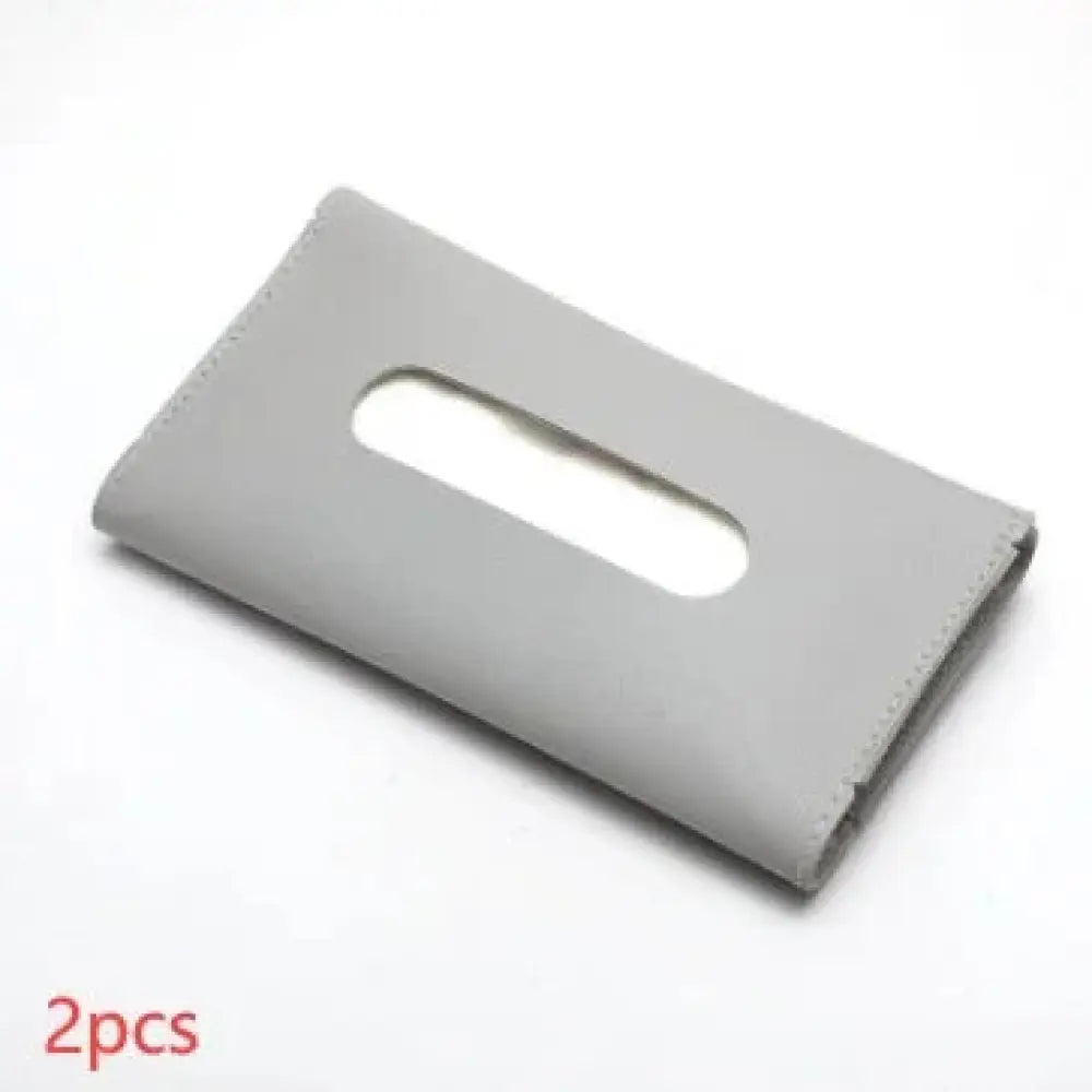 Gray leather car sun visor tissue box holder with smooth matte finish and neatly stitched edges