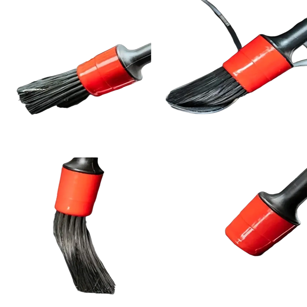 Red and black car interior cleaning brush with soft bristles from the car washing kit and detailing brush set