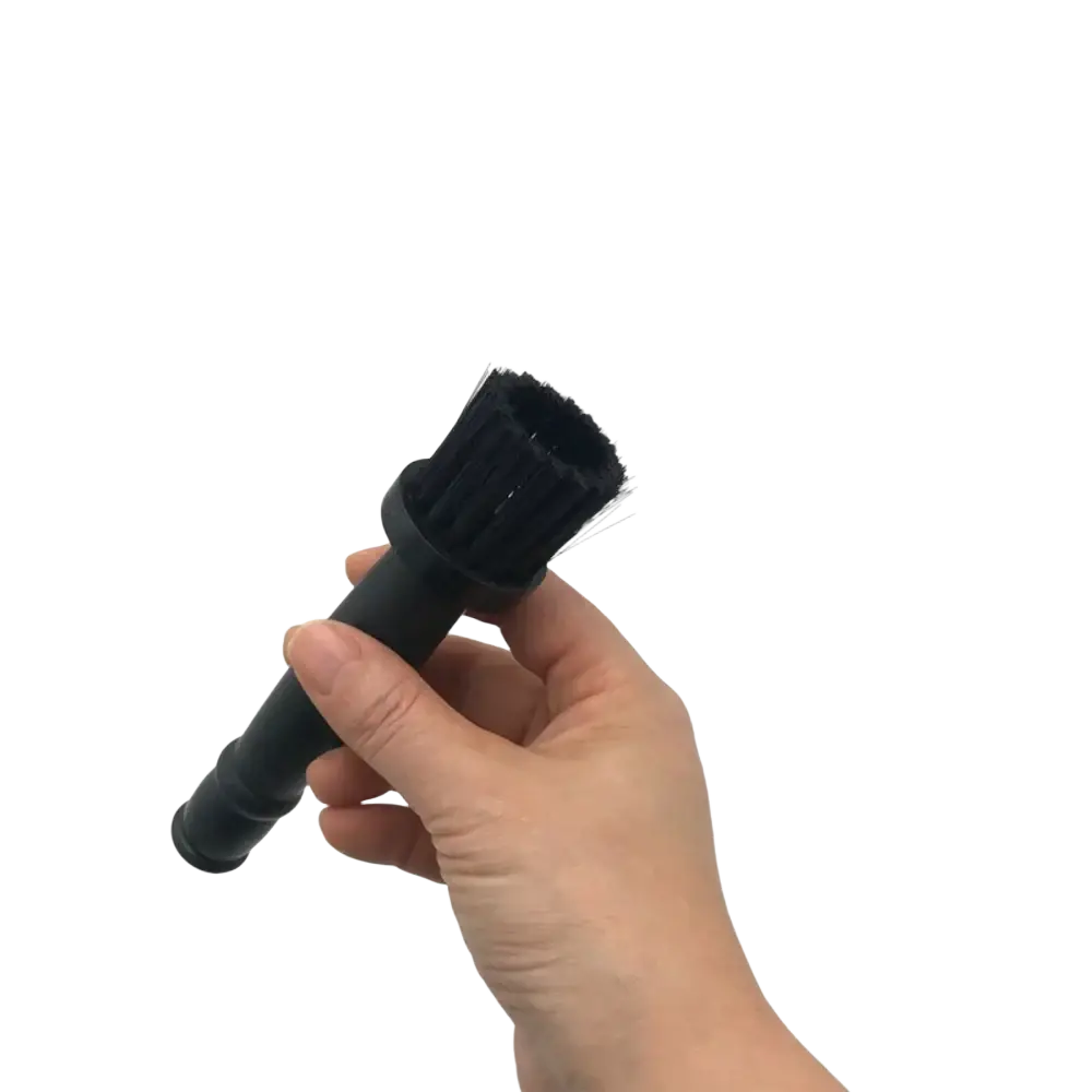 Black bristle brush with sturdy plastic handle for car wheel detailing and rim cleaning in a cleaning brush set