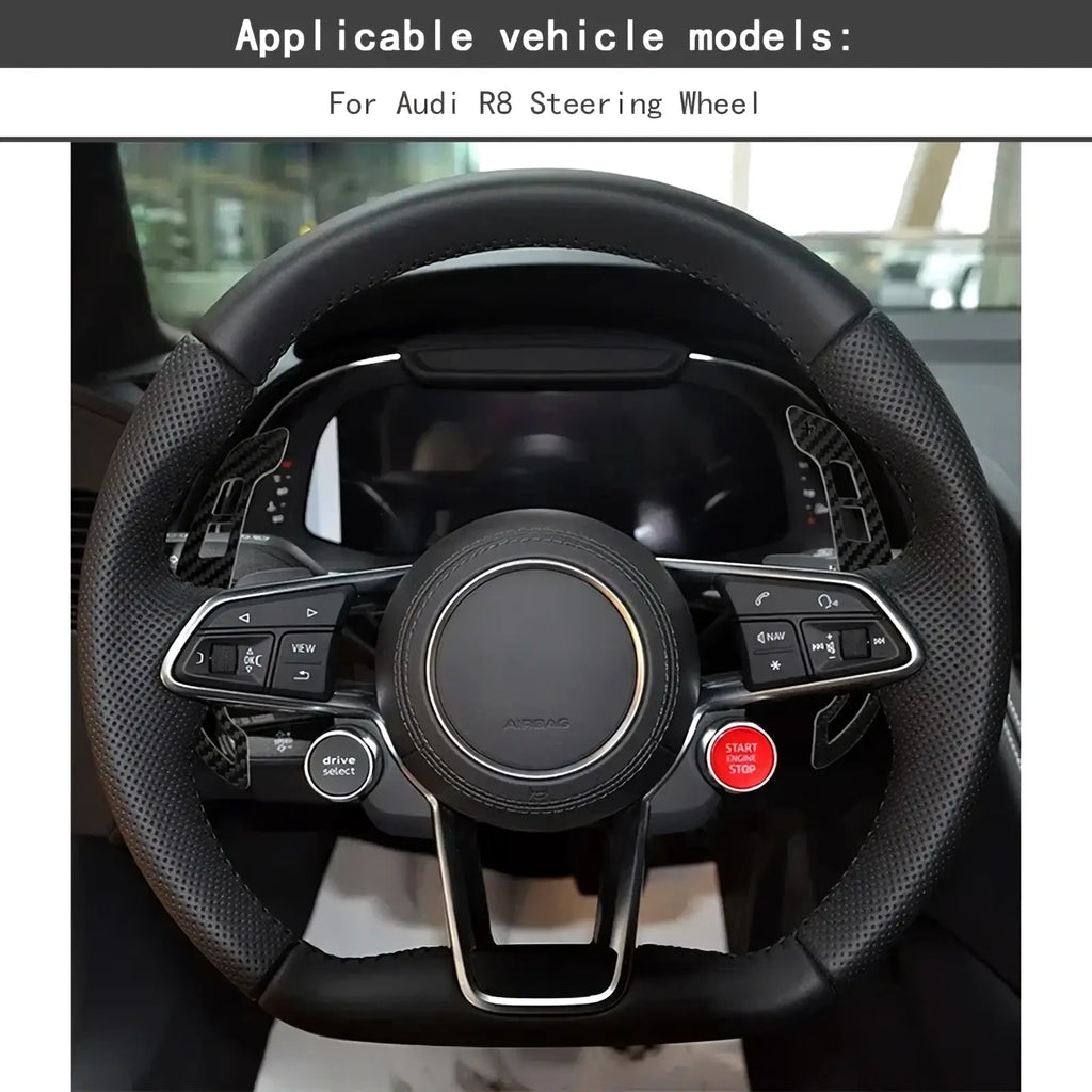 Black leather audi r8 steering wheel with carbon fiber accents and silver trim featuring magnetic shift paddles
