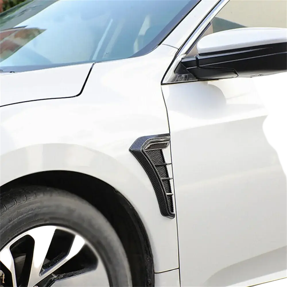Carbon fiber car fender side vent grille cover with sleek angular black carbon fiber side skirt accent