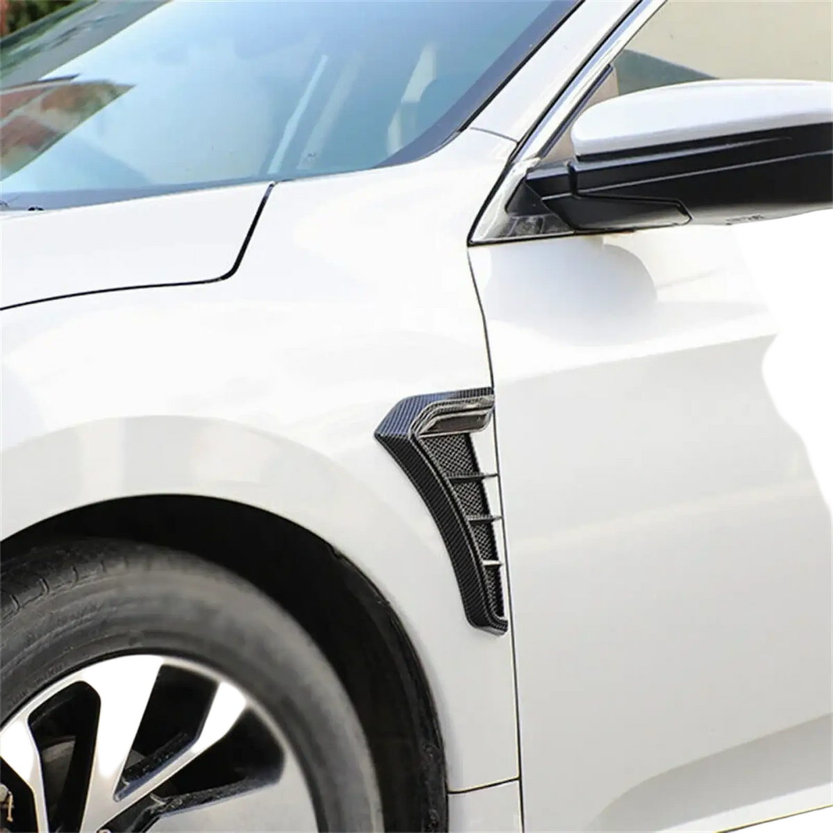 Carbon fiber car fender side vent grille cover with sleek angular black carbon fiber side skirt accent