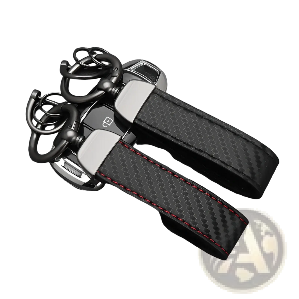 Carbon fiber car keychain with black fiber, red stitching, and silver metal accents for stylish key organization