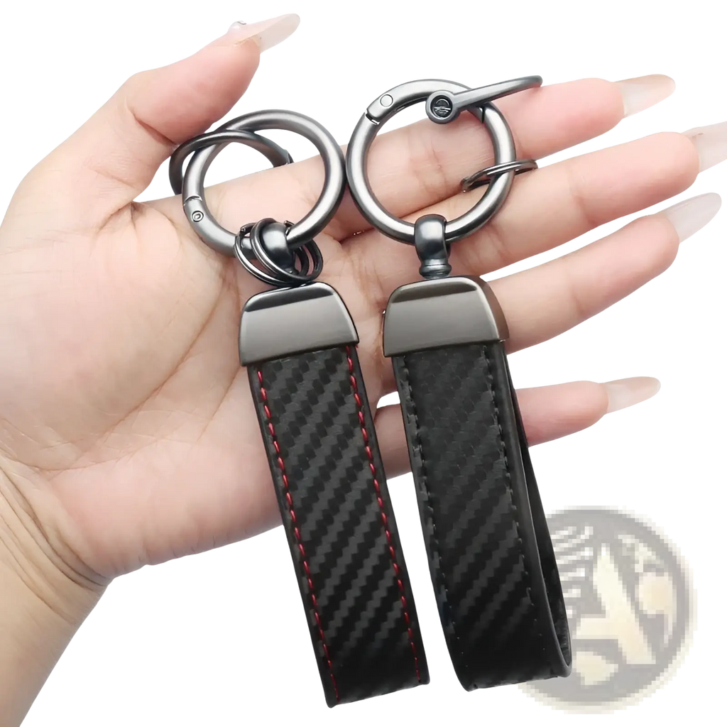 Carbon fiber car keychains with red stitching and metallic silver hardware for stylish key organization