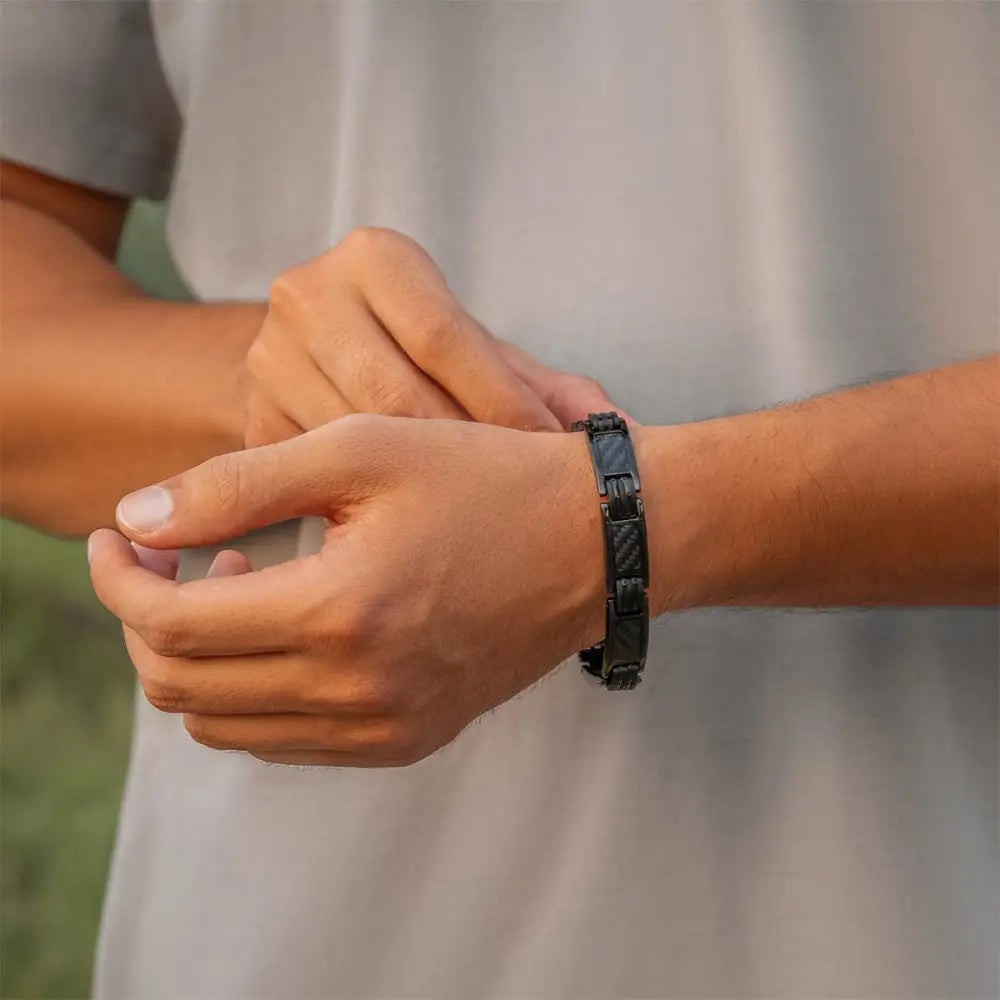 Men’s titanium carbon fiber magnetic therapy bracelet featuring a sleek black carbon fiber design