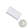 White rectangular carbon fiber portable power bank with dual usb ports and subtle diagonal ribbed texture