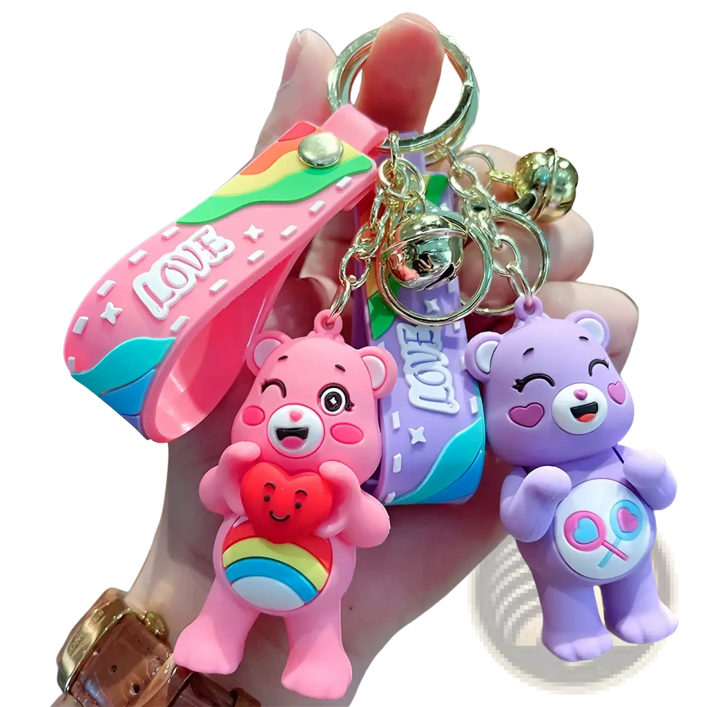 Care bears silicone cartoon keychain backpack pendant in pink and purple with rainbow details holding heart charms