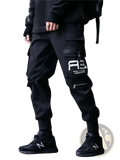 Black cargo joggers for men featuring multiple pockets and a white graphic logo on the thigh ideal for streetwear
