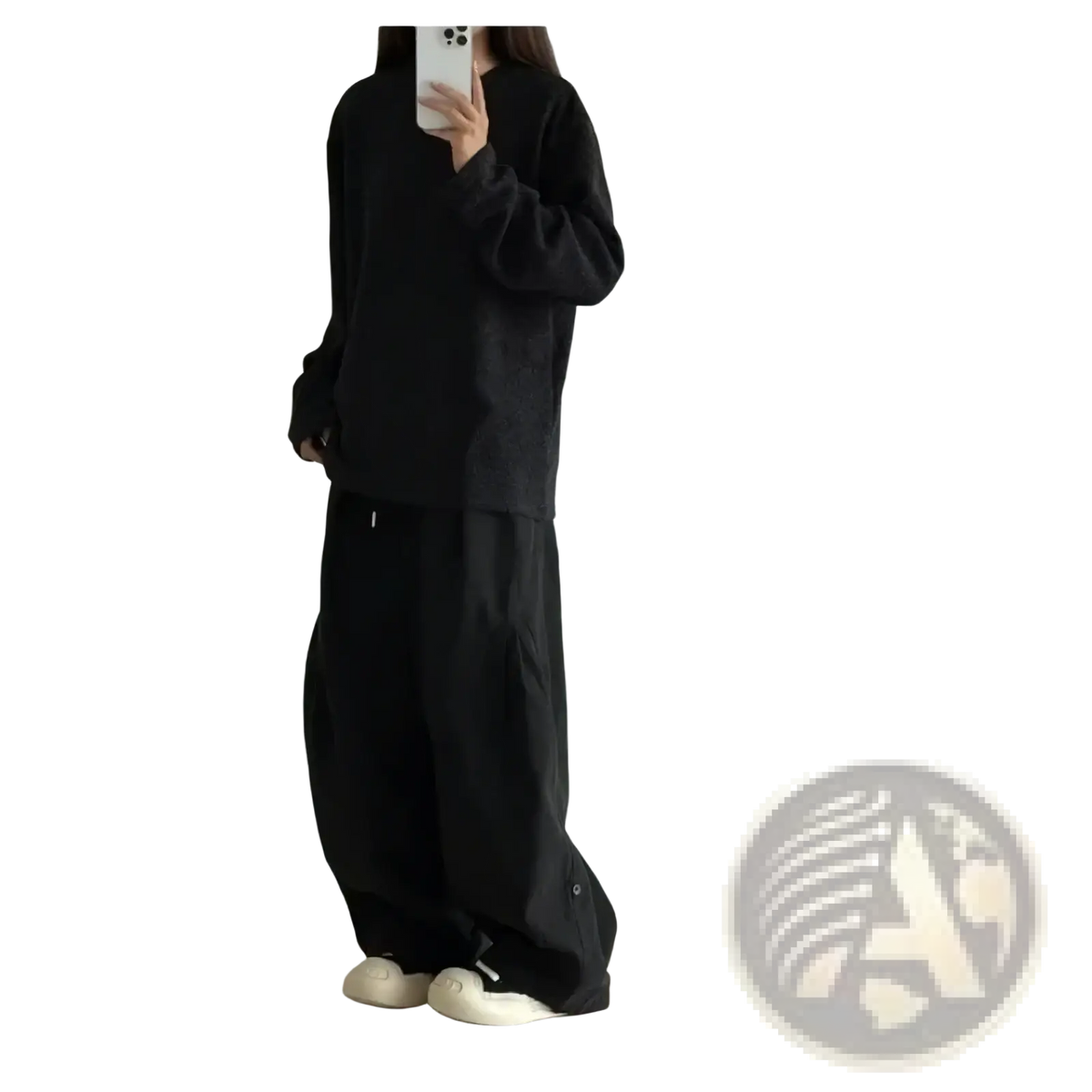 Black oversized long-sleeve top with relaxed fit and subtle texture paired with olive green twill cargo pants for men